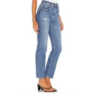 Levi’s 501 high-waisted medium-wash distressed jeans. 💙